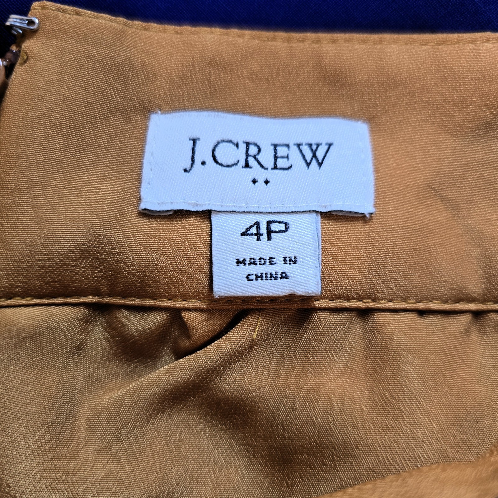 J.Crew pleated midi skirt in leopard print, labeled Women’s Size 4P.
