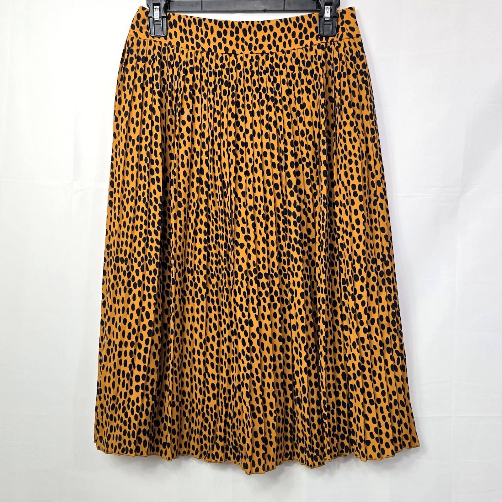 J.Crew pleated midi skirt in leopard print, labeled Women’s Size 4P.