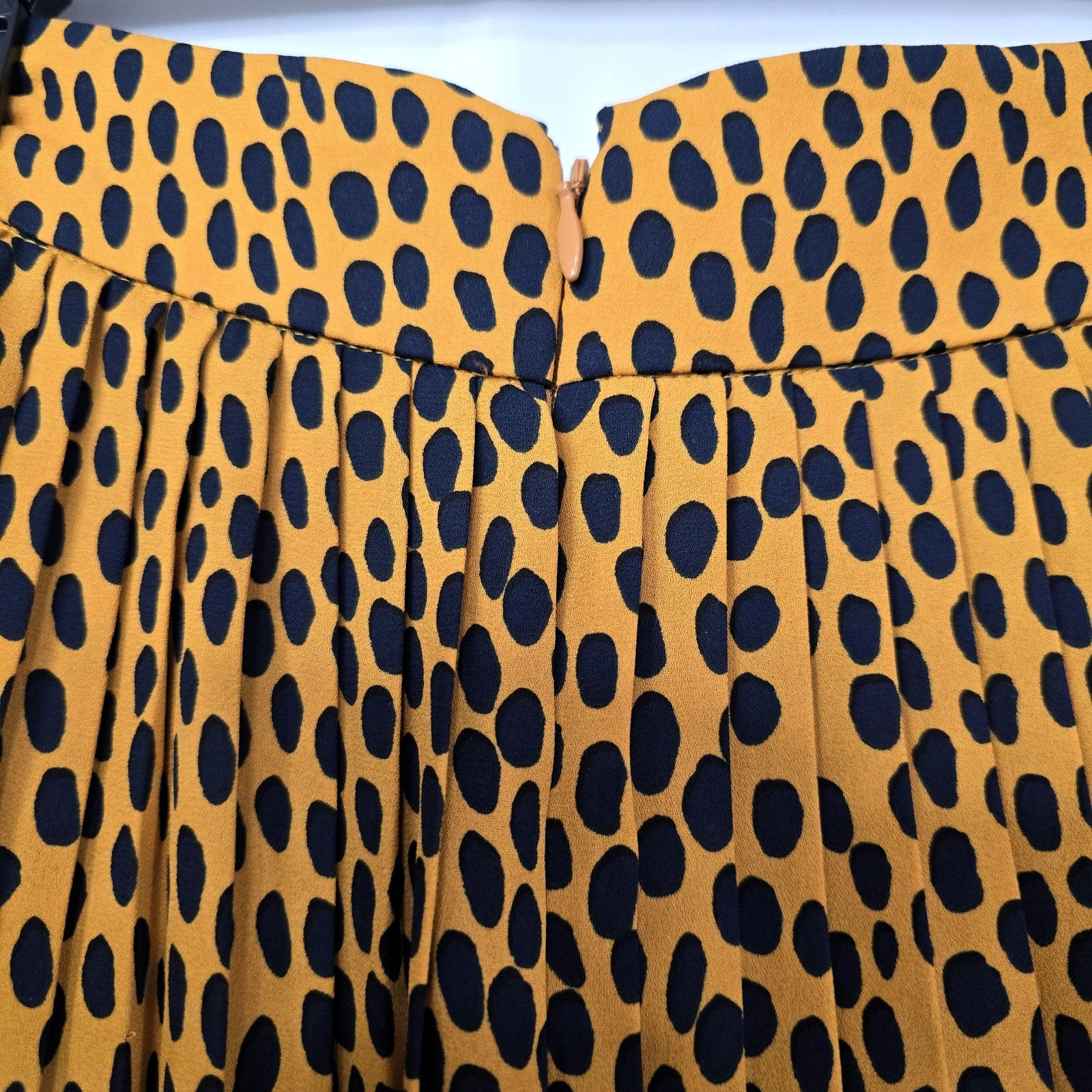 J.Crew pleated midi skirt in leopard print, labeled Women’s Size 4P.