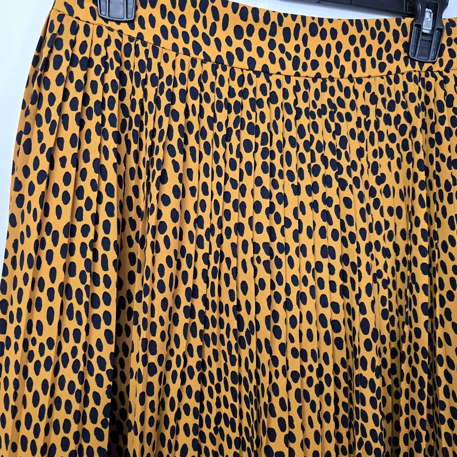 J.Crew pleated midi skirt in leopard print, labeled Women’s Size 4P.