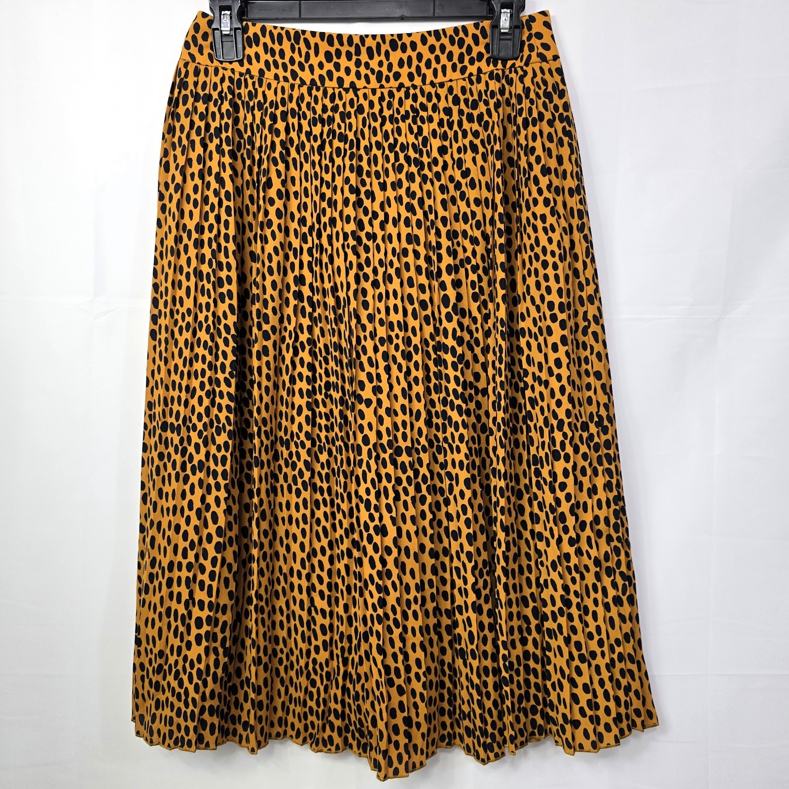 J.Crew pleated midi skirt in leopard print, labeled Women’s Size 4P.